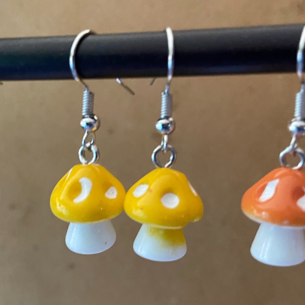 Small yellow mushroom earrings.